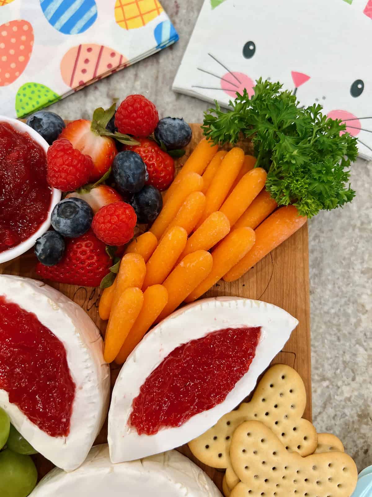 Baby carrots arranged to look like a large carrot, with parsley as the top.
