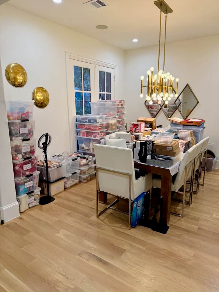 Maegan's dining room stacked with bins.