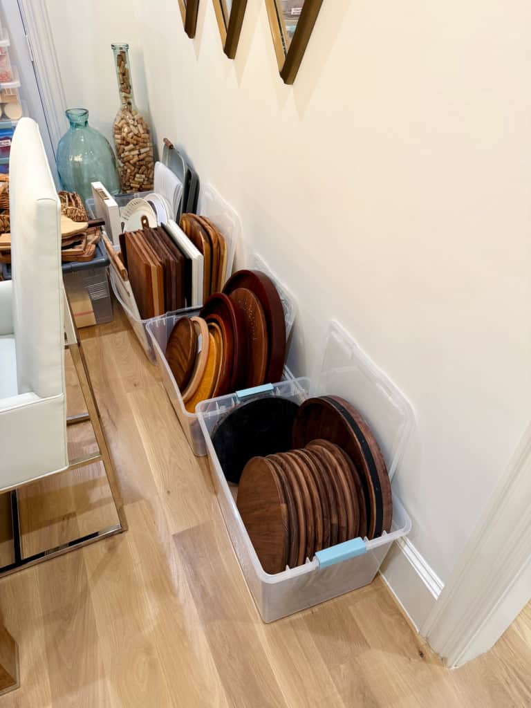 Food boards stashed in bins against a wall in Maegan's office.