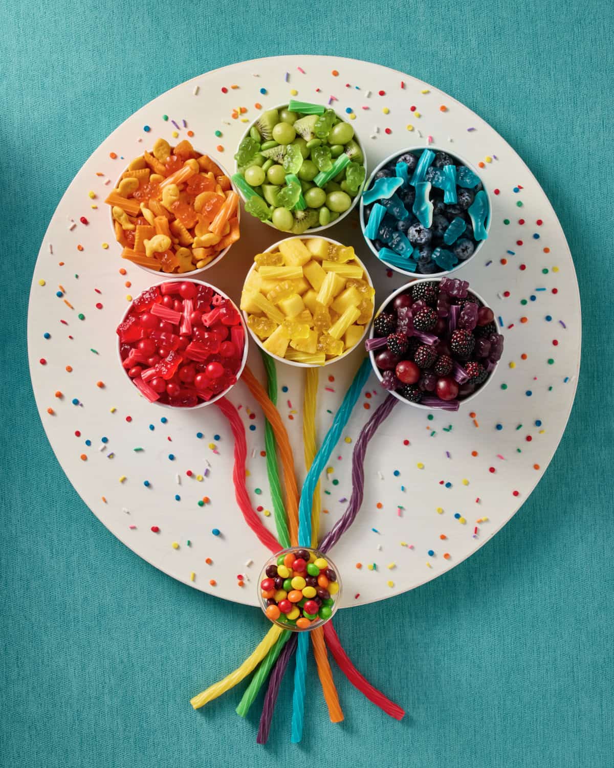Celebration Snack Board on a turquoise background.