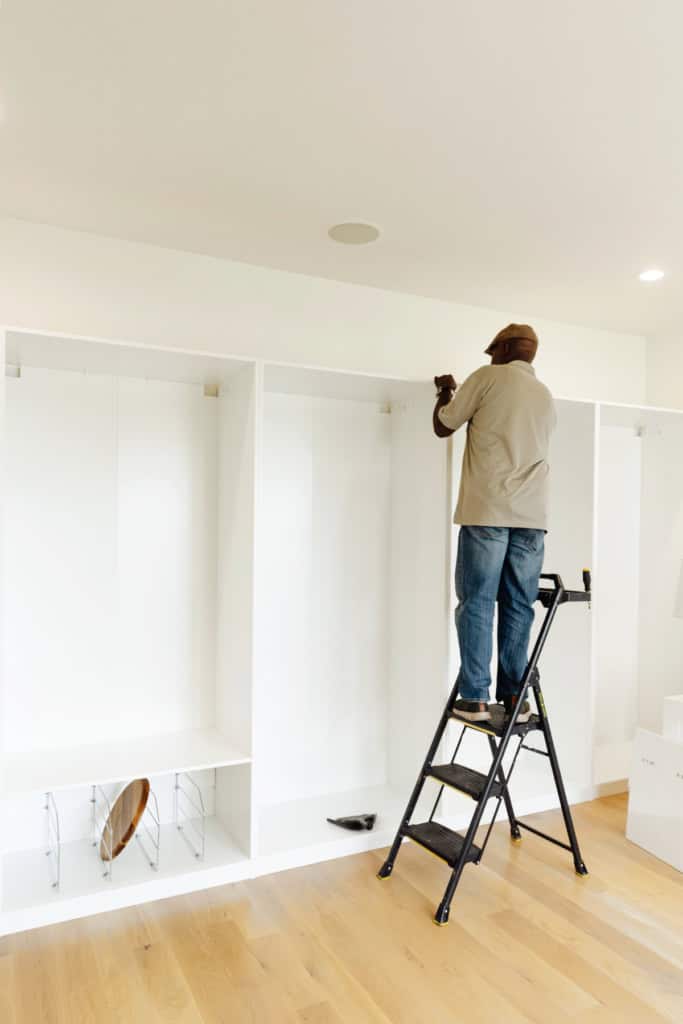 Shelving being installed in Maegan's Office.