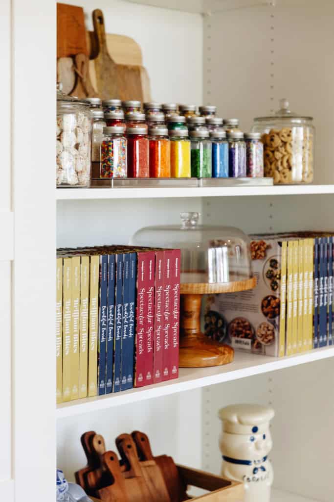A colorful display of baking supplies and Maegan's cookbooks.