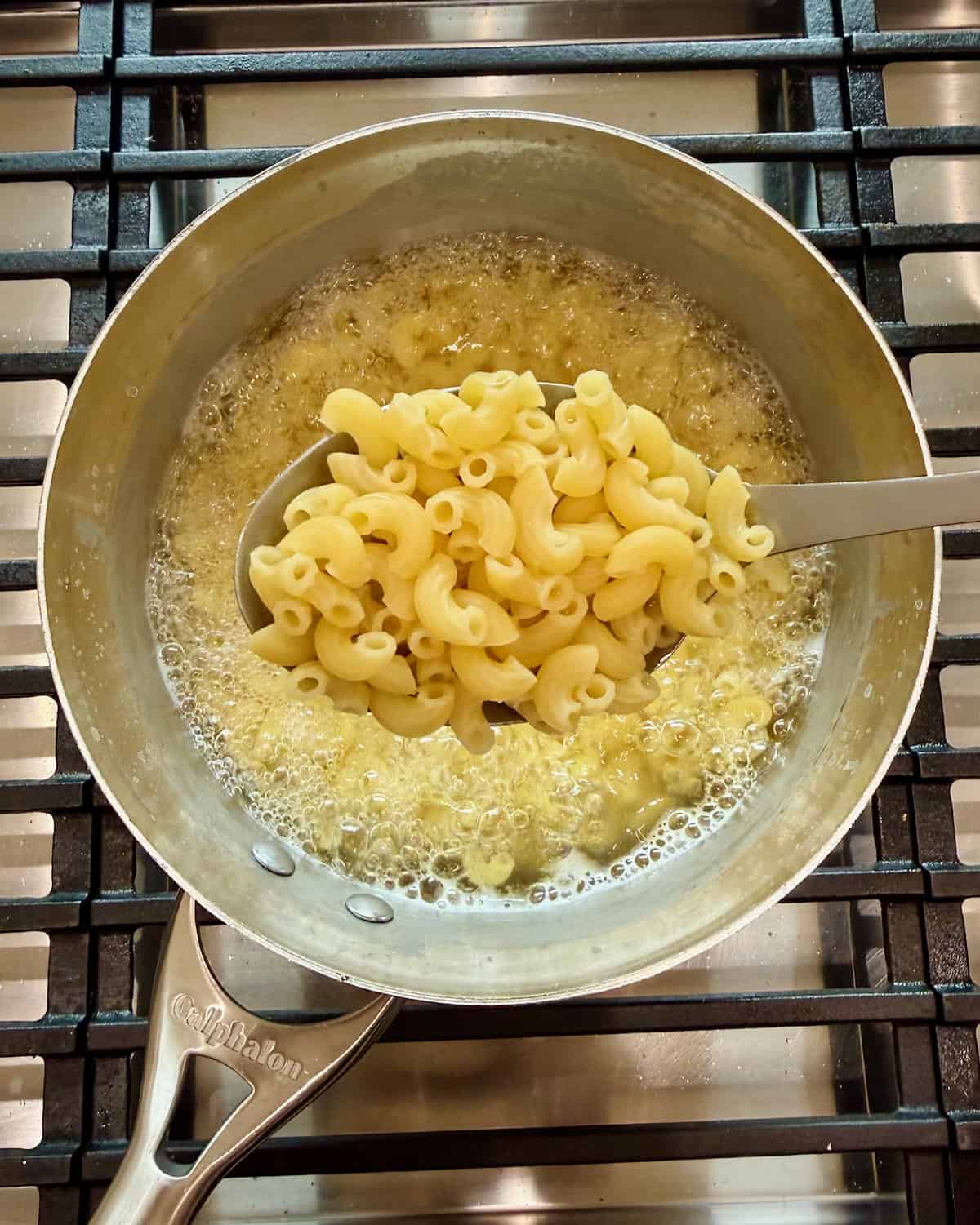 A stainless steel pot of pasta.