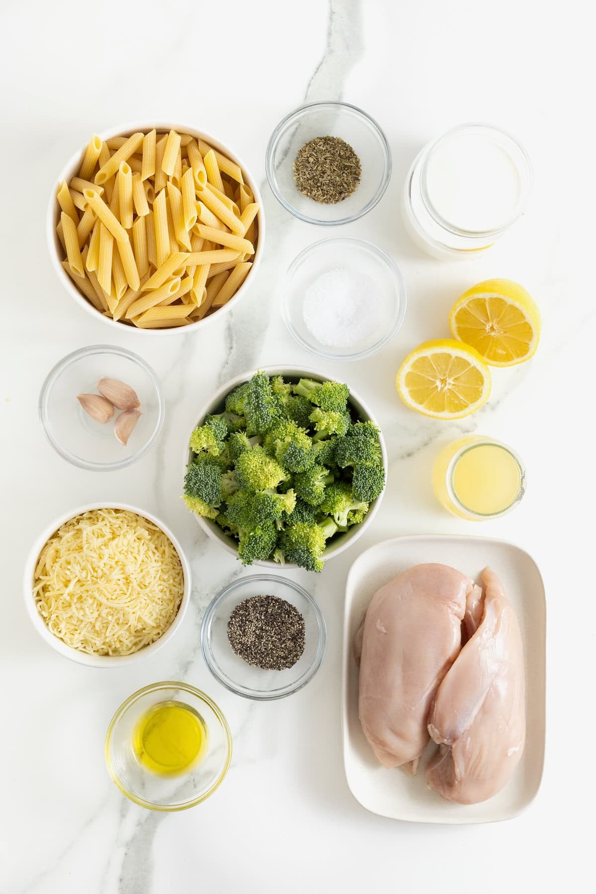 Ingredients to make pasta with broccoli and chicken in a lemon cream sauce.