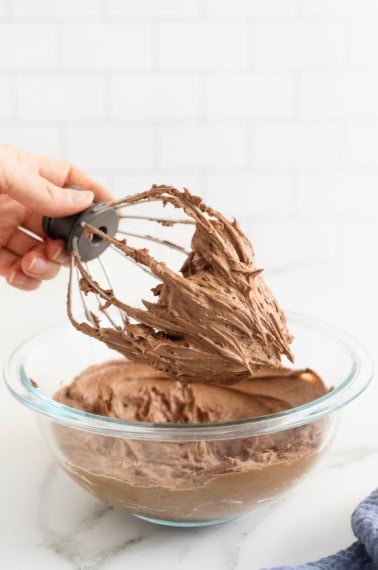 Chocolate frosting on a wire whisk.