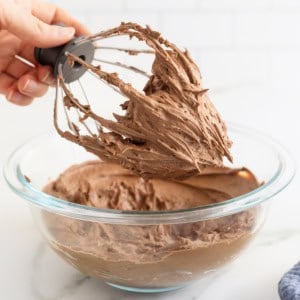 Chocolate frosting on a wire whisk.