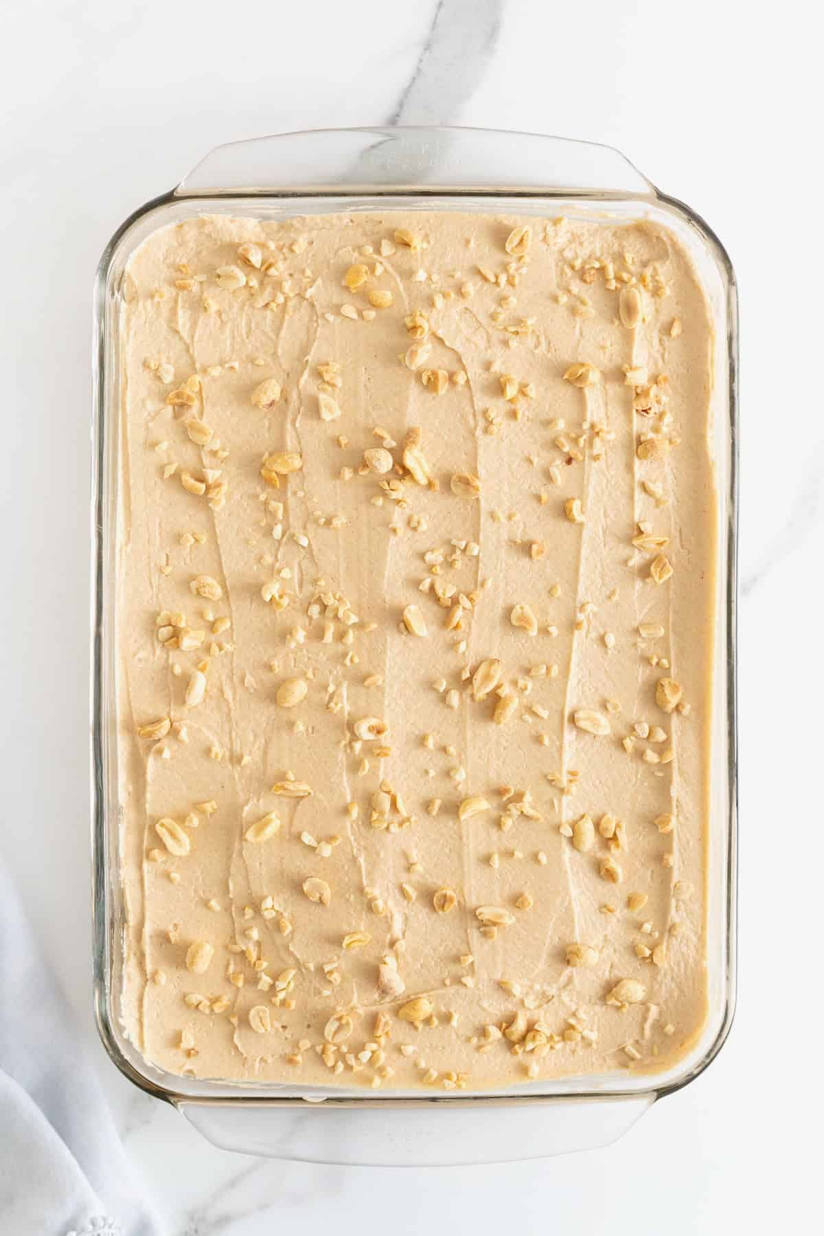 A 9x13 glass dish of peanut butter butter pie bars.