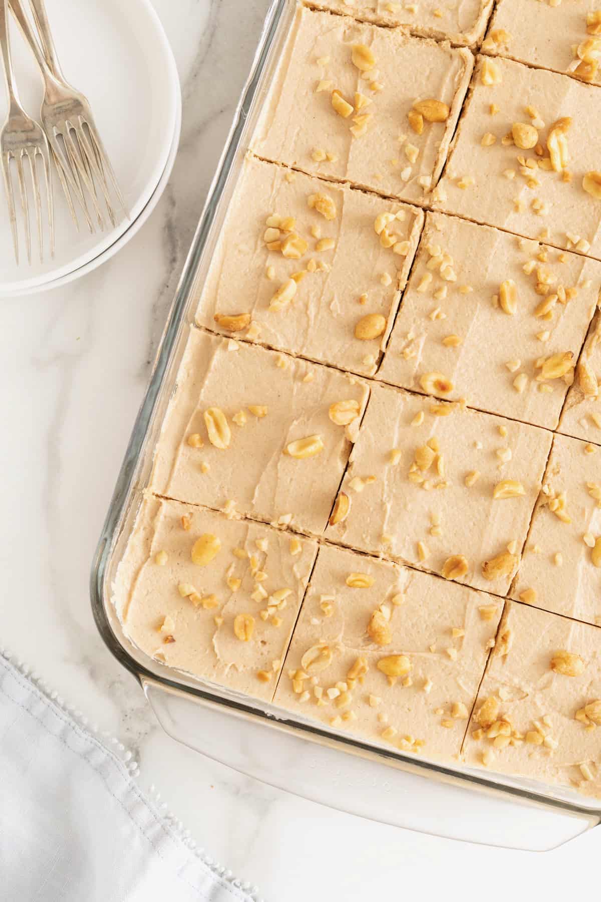 A 9x13 glass dish of peanut butter butter pie bars cut into squares.