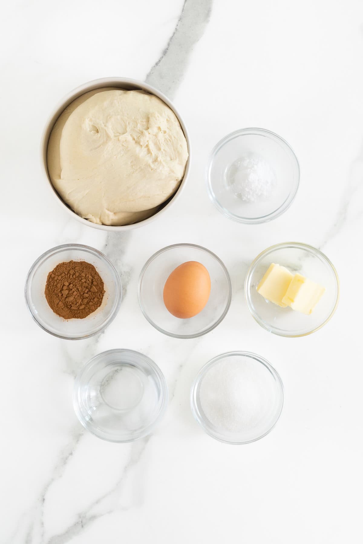 Ingredients to make a jumbo cinnamon sugar soft pretzel.