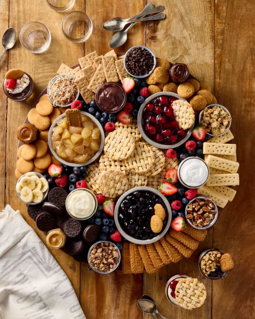 A round food board filled with ingredients to make a pie in a jar.